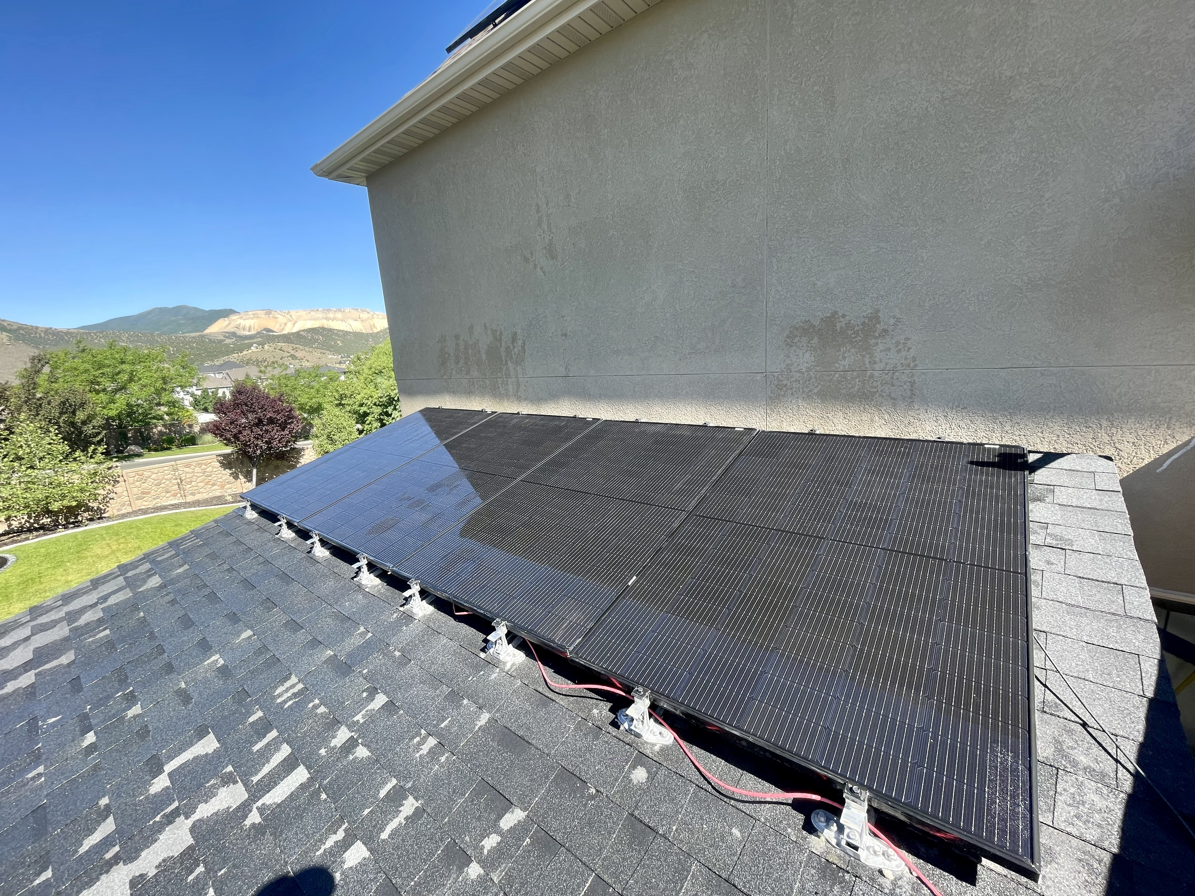 Same rooftop solar panels restored to a clean dark finish
